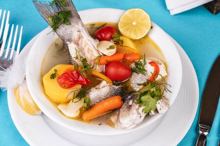 Mediterranean sea-fish soup with vegetables and limeの写真素材
