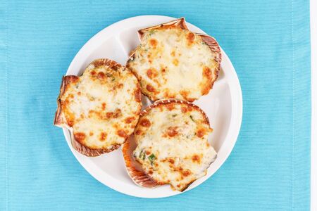 European recipe, Mediterranean dish. Baked mollusks with cheese