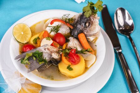 Mediterranean fish soup with vegetables and limeの写真素材
