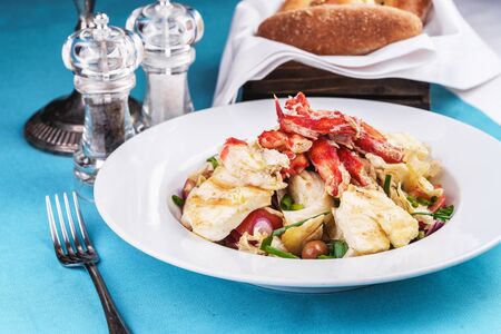 Mediterranean dish made from crab meat, chicken and fresh vegetablesの写真素材