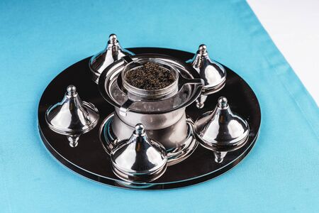 Appetizer of black caviar with assorted saucesの写真素材