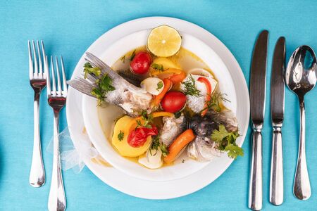 Mediterranean fish soup with vegetables and limeの写真素材