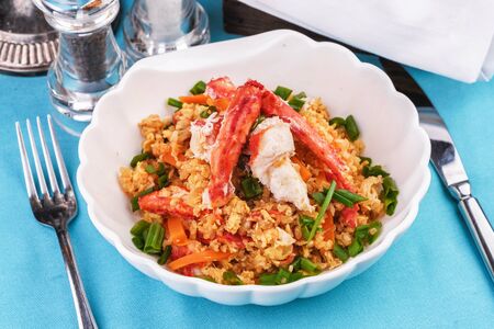 Stewed rice with tomatoes, carrots and crab meat, Japanese cuisineの写真素材