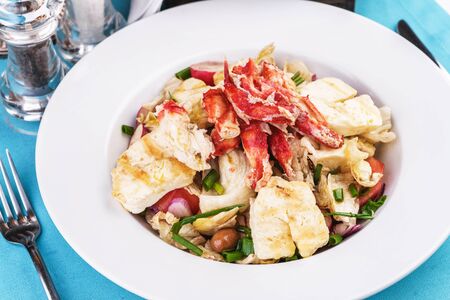 Mediterranean dish made from crab meat, chicken and fresh vegetablesの写真素材