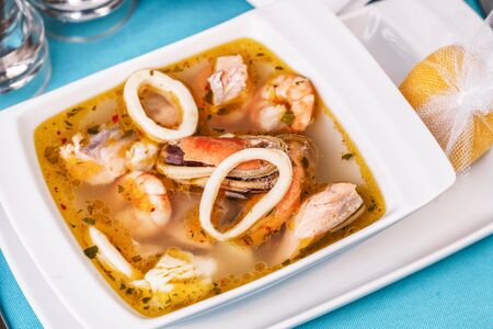 Squid, shrimp, chicken and crab meat soupの写真素材