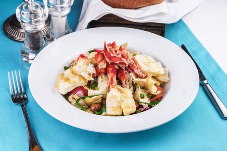 Mediterranean dish made from crab meat, chicken and fresh vegetablesの写真素材