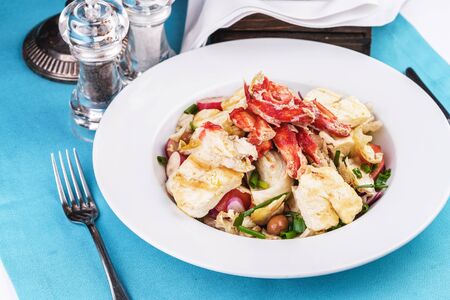Mediterranean dish made from crab meat, chicken and fresh vegetablesの写真素材