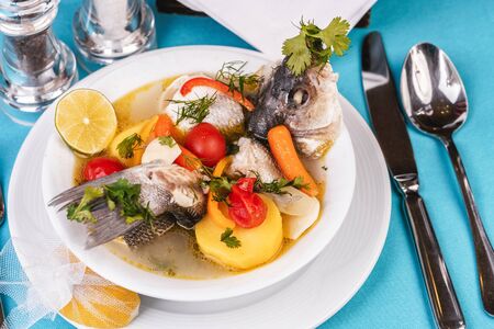 Mediterranean fish soup with vegetables and limeの写真素材