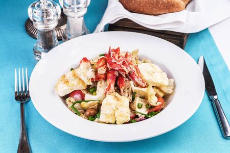 Mediterranean dish made from crab meat, chicken and fresh vegetablesの写真素材