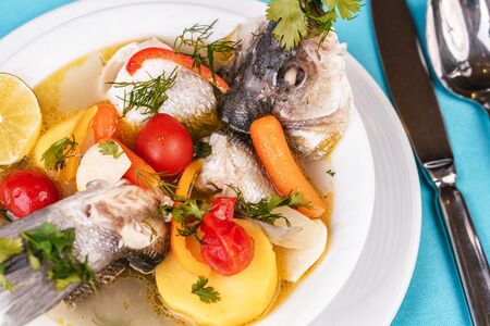 Mediterranean fish soup with vegetables and limeの写真素材