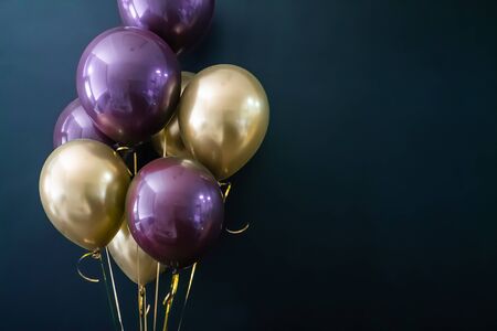 Set of gold and purple balls on a dark background. Holiday concept, postcard, copyspace.の写真素材