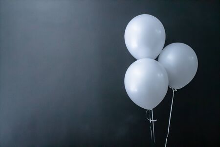 white air round balls on a black background. Valentine's Day, holiday, love. Place for textの写真素材