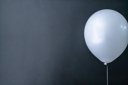 white air round ball on a black background. Valentine's Day, holiday, love. Place for textの写真素材