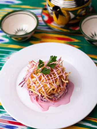 Capercaillie nest salad made of beets, pie potatoes, markovi and greens, topped with mayonnaise. Asian styleの写真素材