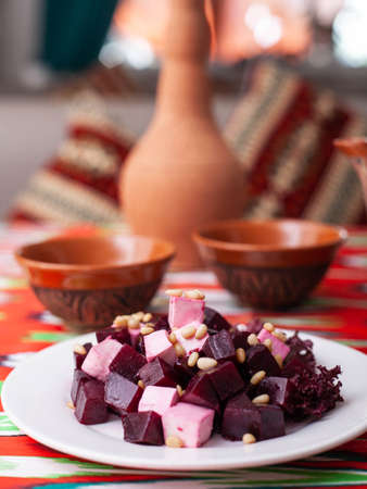 Beetroot and cheese salad with pine nuts dressed with butter. Asian styleの写真素材