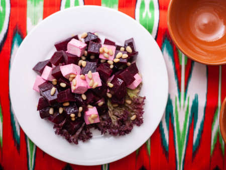 Beetroot and cheese salad with pine nuts dressed with butter. Asian styleの写真素材