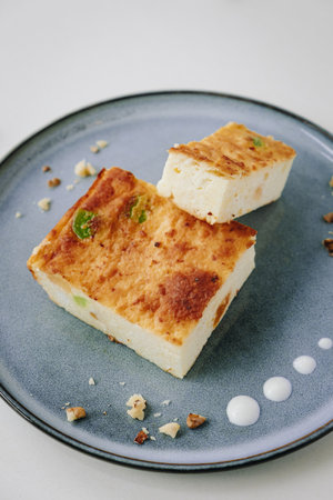 delicate dessert cottage cheese casserole on a light backgroundの写真素材