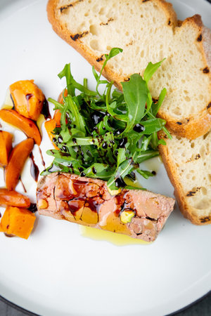 arugula with crusty bread and pate sauce, top view