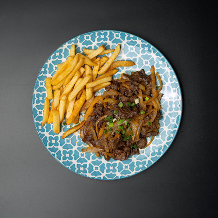 kebab cauldron with french fries on a dark background, top viewの写真素材