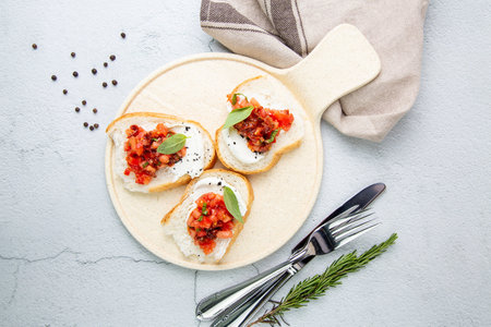 bruschetta with tomatoes and labneh cheese side viewの写真素材