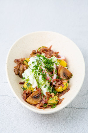 salad with potatoes, rice, meat and green onions top viewの写真素材