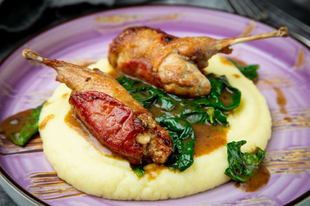 baked chicken wings with gravy, spinach and mashed potatoes top viewの写真素材