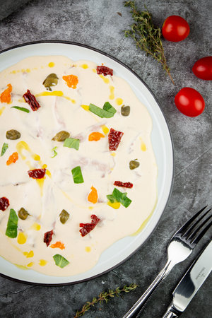 yogurt with additions of syrup, dried fruits and pieces of nuts, top viewの写真素材