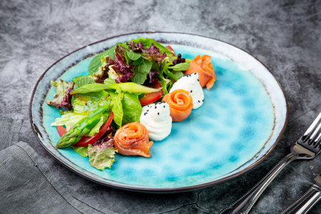 salad of leaves of different types of lettuce and fish rolls, top viewの写真素材