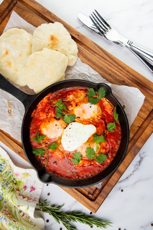 beetroot borscht with sour cream and parsley in a frying pan, side viewの写真素材
