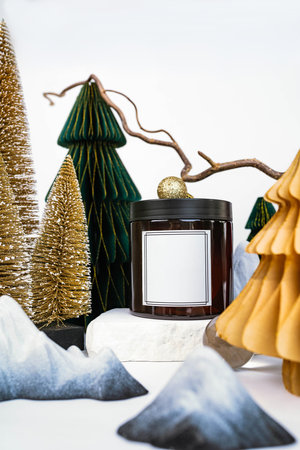 dark jar with lid on the background of Christmas decorations, side viewの写真素材