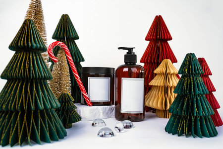 dark jar with lid and dispenser on the background of Christmas decorations, side viewの写真素材