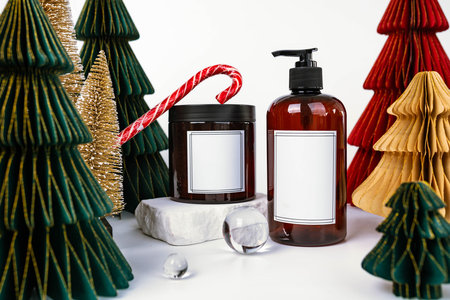 dark jar with lid and dispenser on the background of Christmas decorations, side viewの写真素材