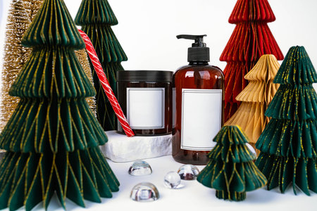 dark jar with lid and dispenser on the background of Christmas decorations, side viewの写真素材