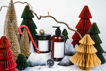dark jar with lid and dispenser on the background of Christmas decorations, side viewの写真素材