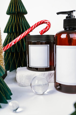 dark jar with lid and dispenser on the background of Christmas decorations, side viewの写真素材