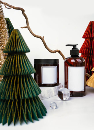 dark jar with lid and dispenser on the background of Christmas decorations, side viewの写真素材