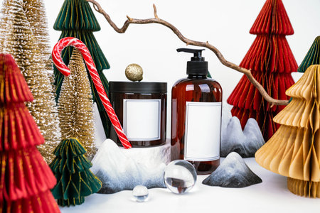 dark jar with lid and dispenser on the background of Christmas decorations, side viewの写真素材