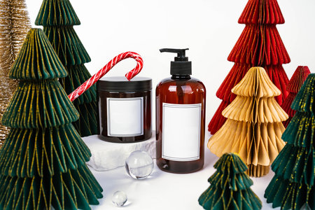 dark jar with lid and dispenser on the background of Christmas decorations, side viewの写真素材