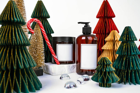 dark jar with lid and dispenser on the background of Christmas decorations, side viewの写真素材