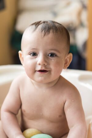 Color portrait of a baby in the bath