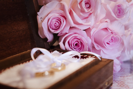 Still life with bouquet of flowers and jewelry of a bride on wedding day.の写真素材