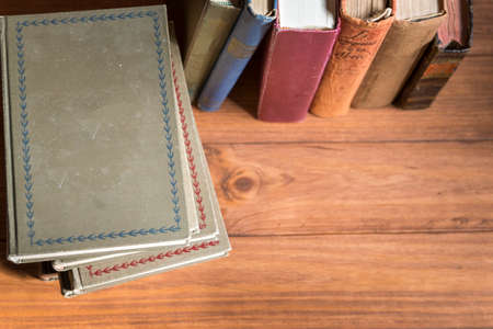 Aerial view of a pile of old books in which the texture of the covers can be seenの写真素材