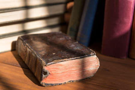Detail photograph of an old book in which the texture of the cover is appreciated with a stack of...