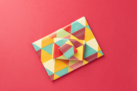 Christmas concept. Gift on red background.の写真素材