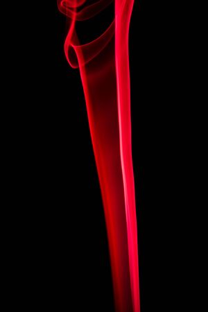 Abstract shape of red smoke on black background.の写真素材
