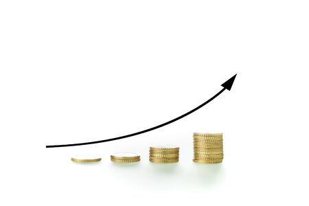 Coins grouped in uneven piles and an upward arrow on white background, showing the concept of economic ascent and rising economy.の写真素材