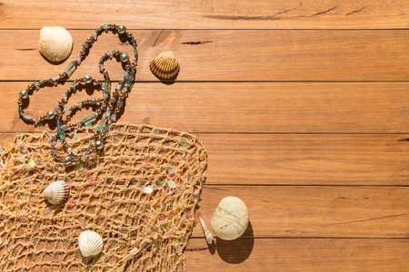 Top view of beach objects, face mask and hydro alcoholic gel on pink background. Summer and vacation concept during the covid19 coronavirus pandemic.の写真素材