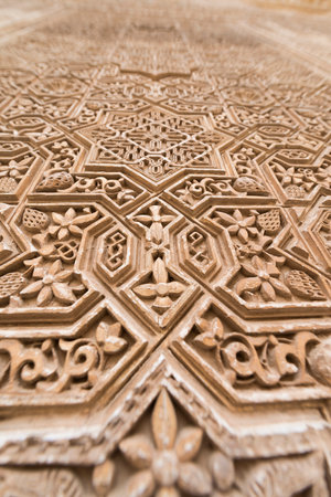 Architectural detail of a wall decorated with Islamic geometric designs in the Alhambra, Granada (Spain).の写真素材