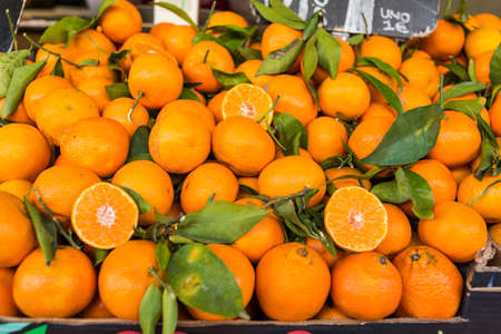 Oranges exposed in the market. Oranges are an important source of vitamin C.