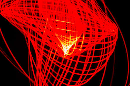 Pattern of red lines on a black background painted with the light of a lantern.